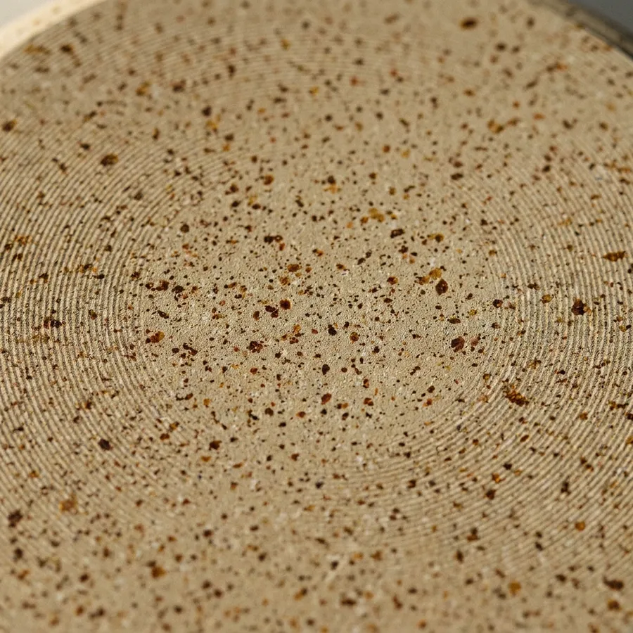 Illustrative speckled cookware surface